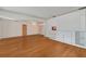 Living room with hardwood floors and built-in cabinetry at 7979 Garden N Dr, St Petersburg, FL 33710