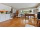 Spacious living room with hardwood floors, a piano, and built-in shelving at 7979 Garden N Dr, St Petersburg, FL 33710