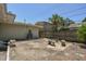 Backyard with concrete patio, wooden fence, and stone benches at 7979 Garden N Dr, St Petersburg, FL 33710