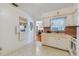 Retro kitchen with white cabinets and pink countertops at 7979 Garden N Dr, St Petersburg, FL 33710