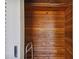 Empty cedar closet with wood shelving and a walker at 7979 Garden N Dr, St Petersburg, FL 33710