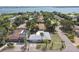 Aerial view showcasing a neighborhood with lush greenery and waterfront views at 7979 Garden N Dr, St Petersburg, FL 33710