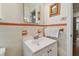 Bathroom with a vanity and a large mirror at 7979 Garden N Dr, St Petersburg, FL 33710