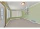 Sunroom with light walls and neutral carpeting at 7979 Garden N Dr, St Petersburg, FL 33710