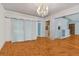 Bright dining room with hardwood floors and a chandelier at 7979 Garden N Dr, St Petersburg, FL 33710
