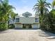 Beach house with double garages and driveway at 20052 Gulf Blvd, Indian Shores, FL 33785
