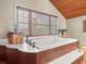 Relaxing bathroom with a deep soaking tub and modern fixtures at 20052 Gulf Blvd, Indian Shores, FL 33785