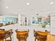Open kitchen with white cabinets, large island, and ocean views at 20052 Gulf Blvd, Indian Shores, FL 33785