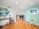 Bright entryway with hardwood floors, coastal decor, and view to living area at 20052 Gulf Blvd, Indian Shores, FL 33785