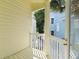 Private balcony overlooking neighboring buildings and foliage at 20052 Gulf Blvd, Indian Shores, FL 33785