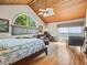 Main bedroom with hardwood floors, large windows, and ocean view at 20052 Gulf Blvd, Indian Shores, FL 33785