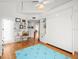 Bedroom with hardwood floors, built-in murphy bed, and a light and airy feel at 20052 Gulf Blvd, Indian Shores, FL 33785