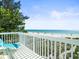Deck overlooking a beautiful beach with ocean views at 20052 Gulf Blvd, Indian Shores, FL 33785