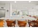 Kitchen with breakfast bar seating and white cabinetry at 20052 Gulf Blvd, Indian Shores, FL 33785