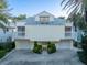 Two-story beach house with double garage and landscaped grounds at 20052 Gulf Blvd, Indian Shores, FL 33785