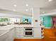 White kitchen with built-in oven and ocean views at 20052 Gulf Blvd, Indian Shores, FL 33785