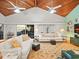 Living room with vaulted ceiling, hardwood floors, and ocean views at 20052 Gulf Blvd, Indian Shores, FL 33785