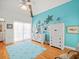 Bedroom with light blue walls, hardwood floors, and built-in shelving at 20052 Gulf Blvd, Indian Shores, FL 33785