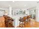 Modern kitchen with white cabinets and large island with seating at 20052 Gulf Blvd, Indian Shores, FL 33785