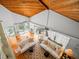 High-ceiling living room with hardwood floors, two sofas and ocean view at 20052 Gulf Blvd, Indian Shores, FL 33785