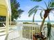 Enjoy ocean breezes on this deck with palm tree at 20052 Gulf Blvd, Indian Shores, FL 33785