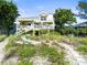 Charming beach house with wrap-around porch and direct beach access at 20052 Gulf Blvd, Indian Shores, FL 33785