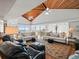 Large living area with hardwood floors, white sofas, and vaulted ceiling at 20052 Gulf Blvd, Indian Shores, FL 33785