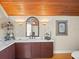 Bathroom with a double vanity and elegant lighting at 20052 Gulf Blvd, Indian Shores, FL 33785
