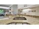Kitchen sink and granite countertop detail at 36750 Us Highway 19 # 23-110, Palm Harbor, FL 34684