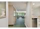 Open concept entryway offering views of the living and dining area at 36750 Us Highway 19 # 23-110, Palm Harbor, FL 34684