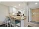 Kitchen with breakfast bar and teal stools at 36750 Us Highway 19 # 23-110, Palm Harbor, FL 34684