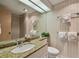 Bathroom featuring granite countertop and updated fixtures at 36750 Us Highway 19 # 23-110, Palm Harbor, FL 34684