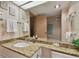 Bright bathroom with granite vanity and bathtub at 36750 Us Highway 19 # 23-110, Palm Harbor, FL 34684