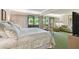 Comfortable bedroom with sitting area and patio access at 36750 Us Highway 19 # 23-110, Palm Harbor, FL 34684
