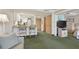 Living room with sofa and view into kitchen area at 36750 Us Highway 19 # 23-110, Palm Harbor, FL 34684
