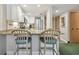 Kitchen with breakfast bar and teal stools at 36750 Us Highway 19 # 23-110, Palm Harbor, FL 34684