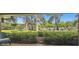 Relaxing patio area overlooking a beautifully landscaped area at 36750 Us Highway 19 # 23-110, Palm Harbor, FL 34684