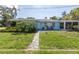 House exterior with stone walkway and lush landscaping at 5 158Th Ave, Redington Beach, FL 33708