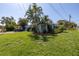 Side view of the house showcasing landscaping and driveway at 5 158Th Ave, Redington Beach, FL 33708
