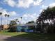 Charming light blue house with a well-maintained lawn at 5 158Th Ave, Redington Beach, FL 33708