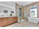 Luxurious bathroom equipped with a double vanity, glass shower, and modern soaking tub at 2721 17Th N Ave, St Petersburg, FL 33713