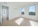 Bright, airy bedroom featuring two windows offering natural light, complemented by light-colored hardwood floors at 2721 17Th N Ave, St Petersburg, FL 33713