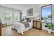 Inviting bedroom features a comfy queen bed, stylish side tables, and well-lit window views with a peaceful color palette at 2721 17Th N Ave, St Petersburg, FL 33713