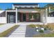 Contemporary home with walkway, landscaping, and attached garage at 2721 17Th N Ave, St Petersburg, FL 33713