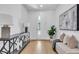 Bright and airy foyer with stylish console table, modern lamps, and a view to the front door at 2721 17Th N Ave, St Petersburg, FL 33713