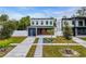 Modern two-story home with a sleek garage, landscaped front yard, and a walkway to the front door at 2721 17Th N Ave, St Petersburg, FL 33713