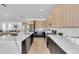 Spacious kitchen featuring a large marble island, sleek cabinetry, and stainless steel appliances at 2721 17Th N Ave, St Petersburg, FL 33713