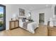 Comfortable bedroom featuring a plush bed, elegant decor, and natural light from large windows at 2721 17Th N Ave, St Petersburg, FL 33713