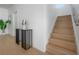 Modern staircase with wooden steps and a minimalist railing, complemented by stylish decor at 2721 17Th N Ave, St Petersburg, FL 33713