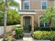 Charming home entrance with a beautifully landscaped front yard and a cozy, inviting doorway at 6546 Marlberry Way, Largo, FL 33773